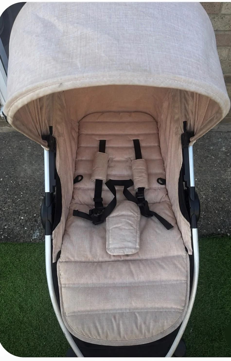 A pushchair seat before professional cleaning