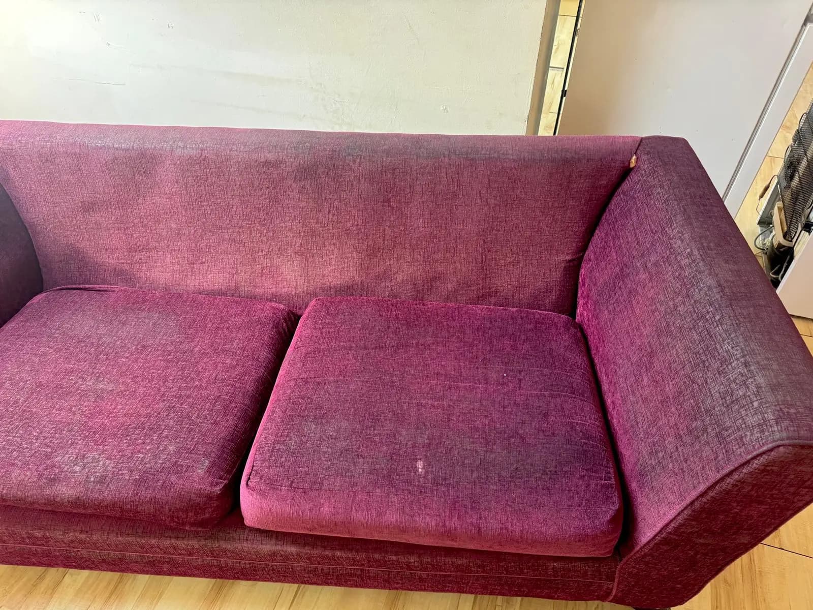 Red upholstered seating before professional cleaning